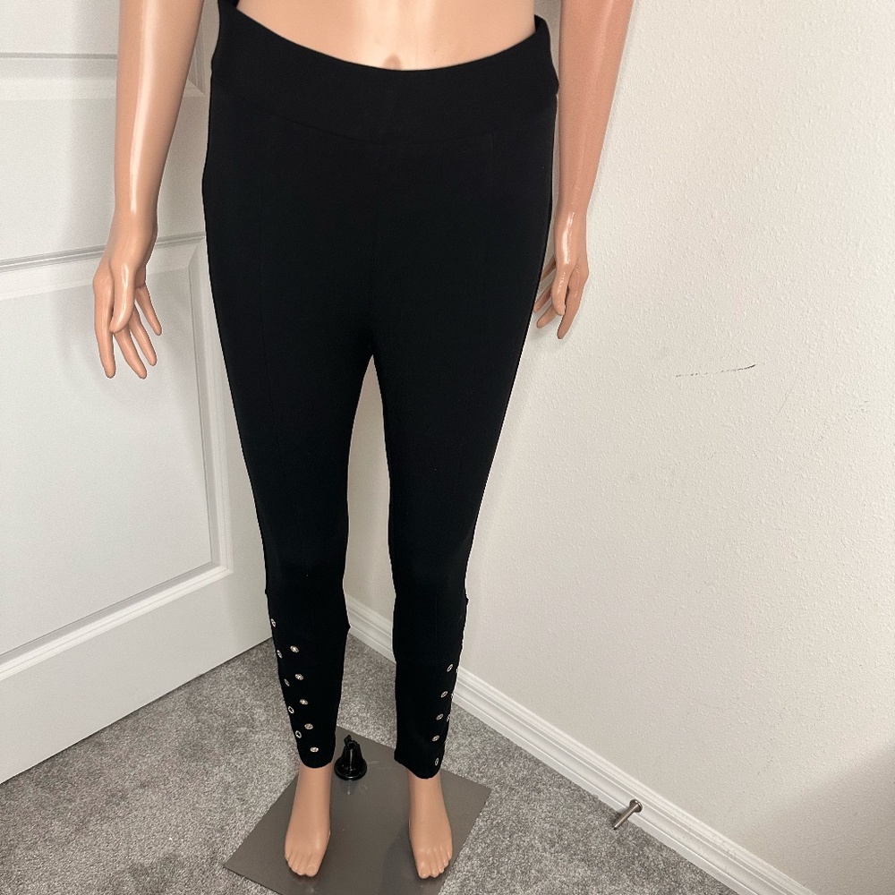 Bebe black studded straight leg pants with tags and in size Medium